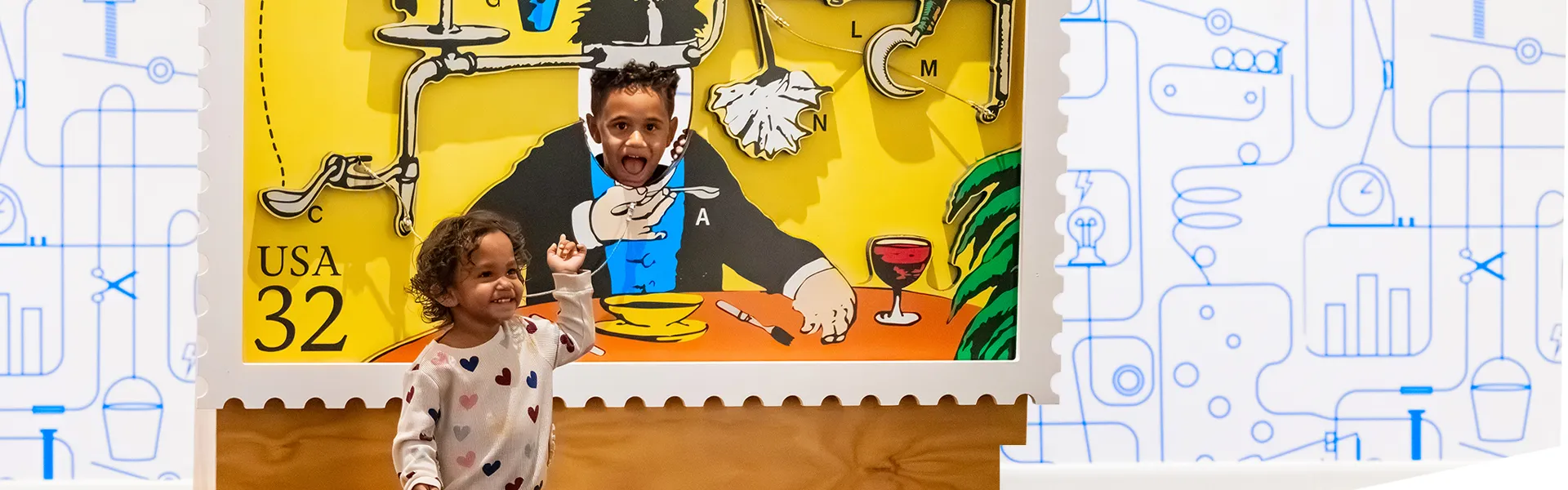 Two kids in a Rube Goldberg photo opportunity